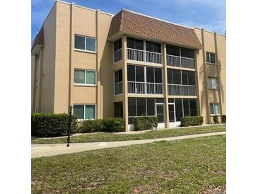 Two-story condo building with balconies and landscaping at 1310 Glen Oaks E Dr # 182E, Sarasota, FL 34232