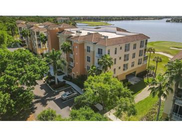Aerial view of condo building near lake and golf course at 6360 Watercrest Way # 301, Bradenton, FL 34202