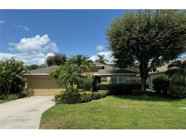 One-story home with a two car garage and lush lawn at 5009 Sturbridge Ct, Sarasota, FL 34238