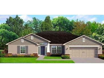 Charming single-story home with a two-car garage, a well-manicured lawn, and beautiful landscaping at 2679 Englewood Rd, Venice, FL 34293