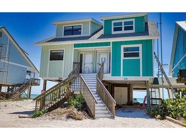 Beachfront duplex with two units, elevated position, and stairs at 301 S Gulf Blvd # 20, Placida, FL 33946