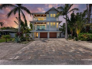 Two-story house with a paver driveway at 2314 Avenue B, Bradenton Beach, FL 34217