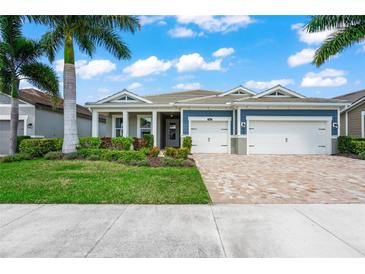 Two-story home with a two-car garage at 5565 Long Shore Loop, Sarasota, FL 34238