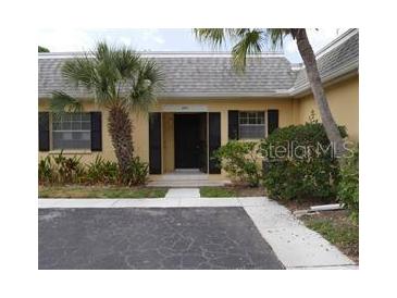 Condo entrance with well manicured landscaping at 2411 Aspinwall St # 2411, Sarasota, FL 34237
