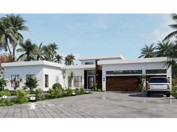 Modern home with a two-car garage and sleek design at 1429 N Lake Shore Dr, Sarasota, FL 34231