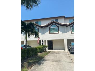 Two-story townhouse with attached garage at 324 Madeira Cir, Tierra Verde, FL 33715