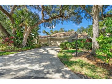 Lovely house exterior with a long driveway at 4560 Forest Wood Trl # 16, Sarasota, FL 34241