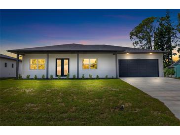 Modern two-bedroom house with a two-car garage at 4593 Targee Ave, North Port, FL 34287