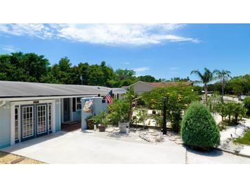 Single story home with double doors, nicely landscaped, and a long driveway at 3005 39Th W Ave, Bradenton, FL 34205