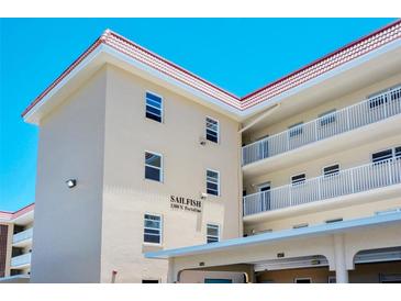 Exterior view of Sailfish condominium building at 1300 N Portofino Dr # 305, Sarasota, FL 34242