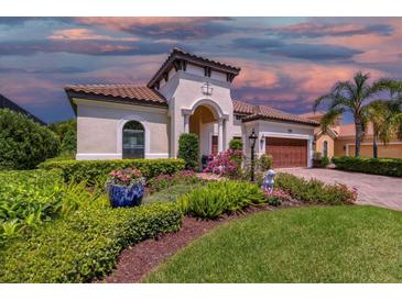 Elegant home with manicured landscaping and brick driveway at 7336 Haddington Cv, Bradenton, FL 34202