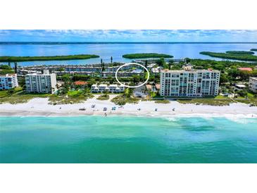Stunning aerial view of the beachfront property and surrounding area at 4350 Chatham Dr # E307, Longboat Key, FL 34228