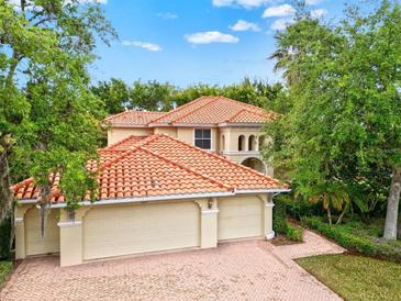 Beautiful two-story home with three-car garage and tile roof at 10115 Day Lily Ct, Bradenton, FL 34212