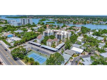 Condominium complex with tennis court and parking at 6157 Midnight Pass Rd # E24, Sarasota, FL 34242