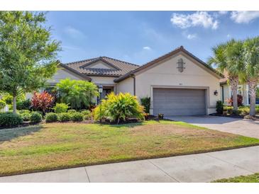 One-story home with landscaped yard at 4811 Cabreo Ct, Lakewood Ranch, FL 34211