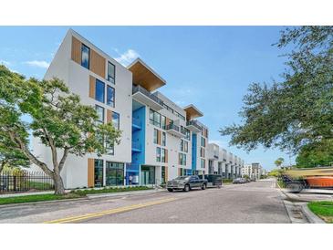 Modern building exterior, featuring clean lines and a mix of white and wood accents at 1558 4Th St # 210, Sarasota, FL 34236
