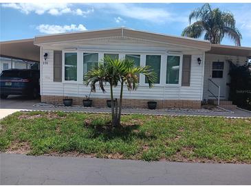 Single-wide mobile home with updated windows and landscaping at 191 Palm Air Dr, Osprey, FL 34229