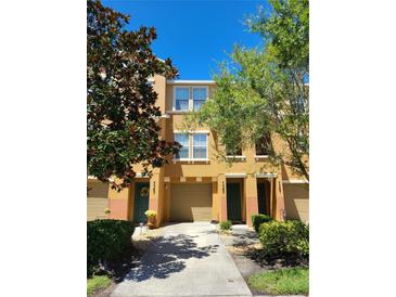 Attractive two-story townhome with driveway and landscaping at 7365 Black Walnut Way, Lakewood Ranch, FL 34202