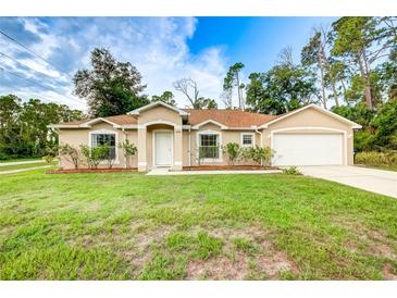 Single-Gathering home with two-car garage and well-maintained lawn at 4005 Belladonna Ave, North Port, FL 34286