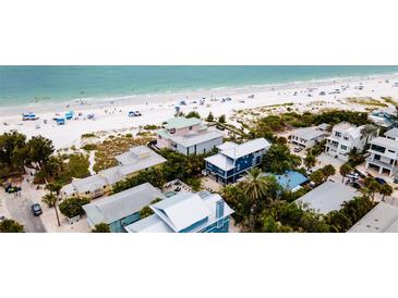 Aerial view of beach homes near the ocean at 107 Elm Ave, Anna Maria, FL 34216