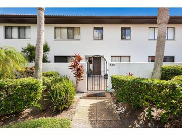 Attractive entryway with lush landscaping and a welcoming gate at 3500 El Conquistador Pkwy # 339, Bradenton, FL 34210