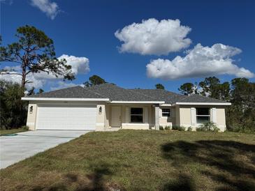 Newly built single-story house with attached garage and lawn at 6732 Beckwith Ave, North Port, FL 34291