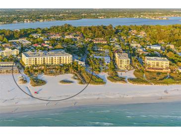 Aerial view of beachfront property showing building and beach at 915 Seaside Dr # 606 Weeks 12-13, Sarasota, FL 34242