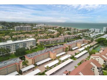Aerial view of condos near the beach and tennis courts at 1300 N Portofino Dr # 208, Sarasota, FL 34242