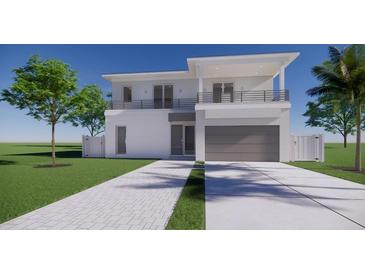 Two-story modern home with gray garage door and balcony at 2516 Browning St, Sarasota, FL 34237