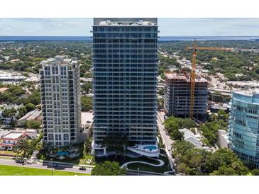 High-rise building with a modern design and a pool at 2912 W Santiago St # 2004, Tampa, FL 33629