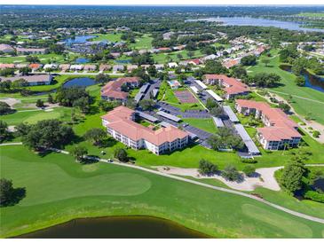 Aerial view of community near golf course at 6505 Stone River Rd # 104, Bradenton, FL 34203