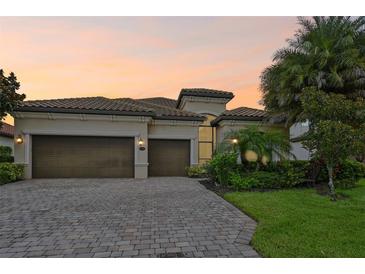 Two-story home with two-car garage and landscaped yard at 13215 Ramblewood Trl, Bradenton, FL 34211