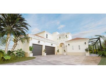 A two-story house with a two-car garage, tile roof and palm trees at 3523 Trebor Ln, Sarasota, FL 34235