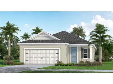 One-story home with garage, landscaping, and palm trees at 10112 Cross River Trl, Parrish, FL 34219