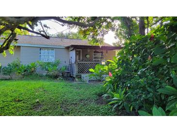 Cozy single-story home with a covered porch at 12004 Big Bend Rd, Riverview, FL 33579