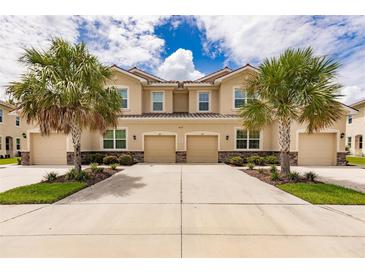 Front view of two-story townhouses at 8269 Enclave Way # 103, Sarasota, FL 34243