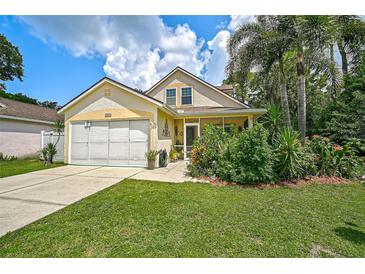 Charming single-Gathering house with a two-car garage and well-maintained landscaping at 3611 Chinaberry Ln, Sarasota, FL 34235