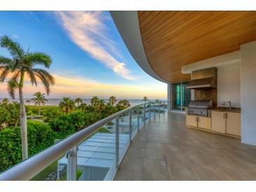 Spacious balcony with ocean view and built-in grill at 2251 Gulf Of Mexico Dr # 301, Longboat Key, FL 34228