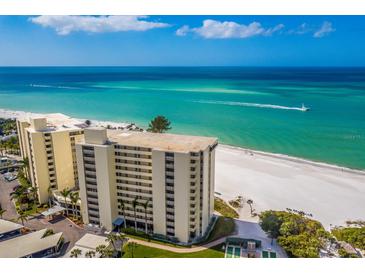 Aerial view of beachfront condo building with ocean views at 20 Whispering Sands Dr # 501, Sarasota, FL 34242