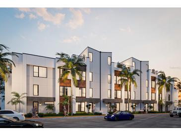 Modern townhouses with palm trees and street parking at 2170 Fruitville Rd, Sarasota, FL 34237