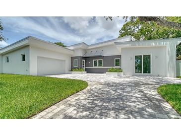 Modern two-story home with a gray and white exterior at 2231 Wood St, Sarasota, FL 34237