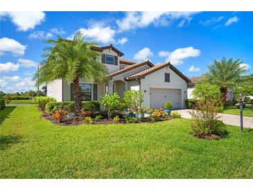 Two-story house with landscaped yard and paver driveway at 17006 Blue Ridge Pl, Lakewood Ranch, FL 34211