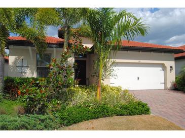 Single-Gathering home with landscaped front yard at 118 Veraza Ct, Nokomis, FL 34275