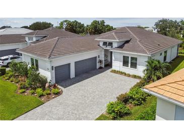 Luxury home with three-car garage and paver driveway at 4952 Surfside Cir, Bradenton, FL 34211