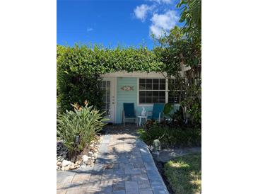 Charming waterfront cottage with lush landscaping and a relaxing patio at 1603 Gulf N Dr # 5, Bradenton Beach, FL 34217