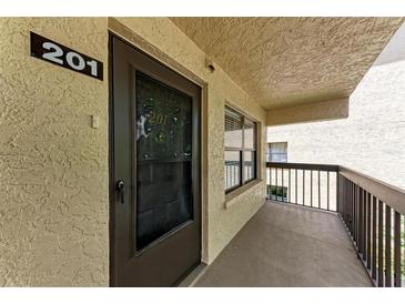 Condo front door with screen door and adjacent balcony at 515 30Th W Ave # H201, Bradenton, FL 34205