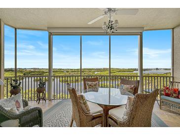 Lanai with glass enclosure offering scenic water views at 409 North Point Rd # 902, Osprey, FL 34229