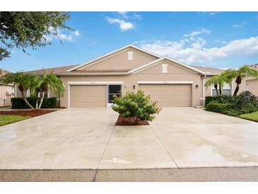 Two-car garage and attractive landscaping at 4405 Lenox Blvd, Venice, FL 34293