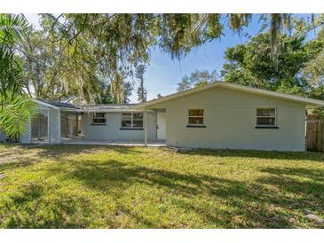 Newly renovated home with a carport and landscaped yard at 403 Pinewood Ave, Nokomis, FL 34275