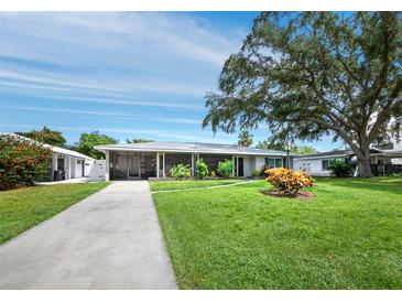 Single story home with carport and landscaped yard at 2907 Marshall Dr, Sarasota, FL 34239